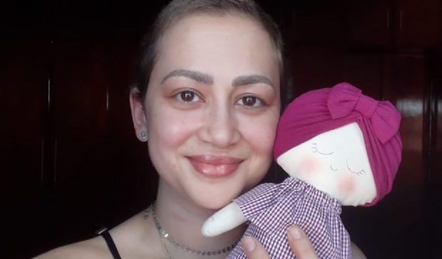 Julia e sua 'boneca esperana'